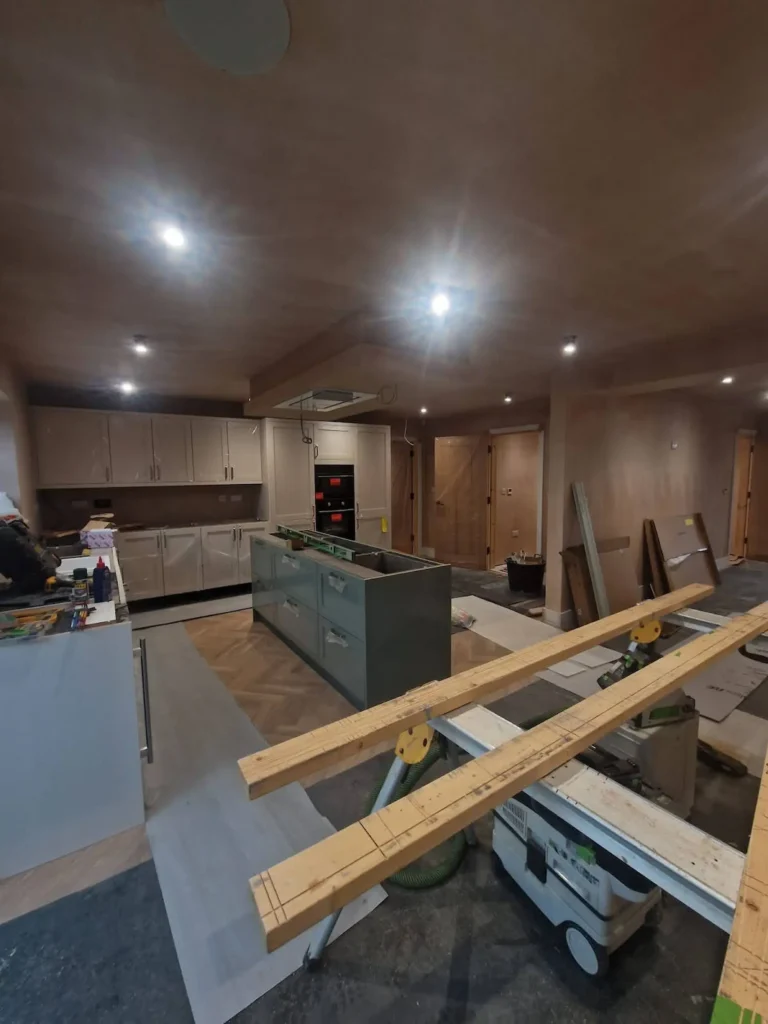Interior kitchen fit-out at the 7 Lakes development by Wroot Homes, showing energy-efficient LED lighting and modern appliances as specified in the SAP report