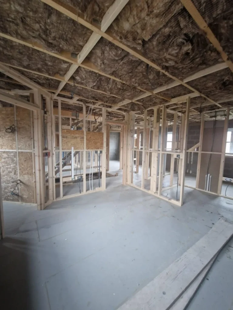 Installed loft insulation in a new timber-framed property at the 7 Lakes development, verifying compliance with SAP energy calculation requirements