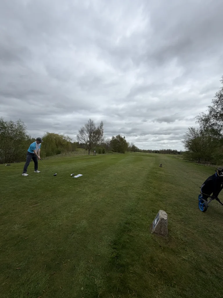 GC Reports supporting the Scunthorpe Town Cricket Club Golf Day. The image shows a participant teeing off at the 17th hole, which was proudly sponsored by GC Reports to help raise funds for local community sports.